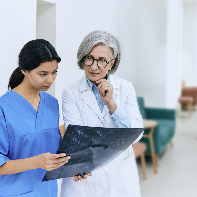 A doctor is seen holding a cell phone