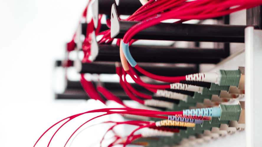 Close-up of a wall with tangled wires.